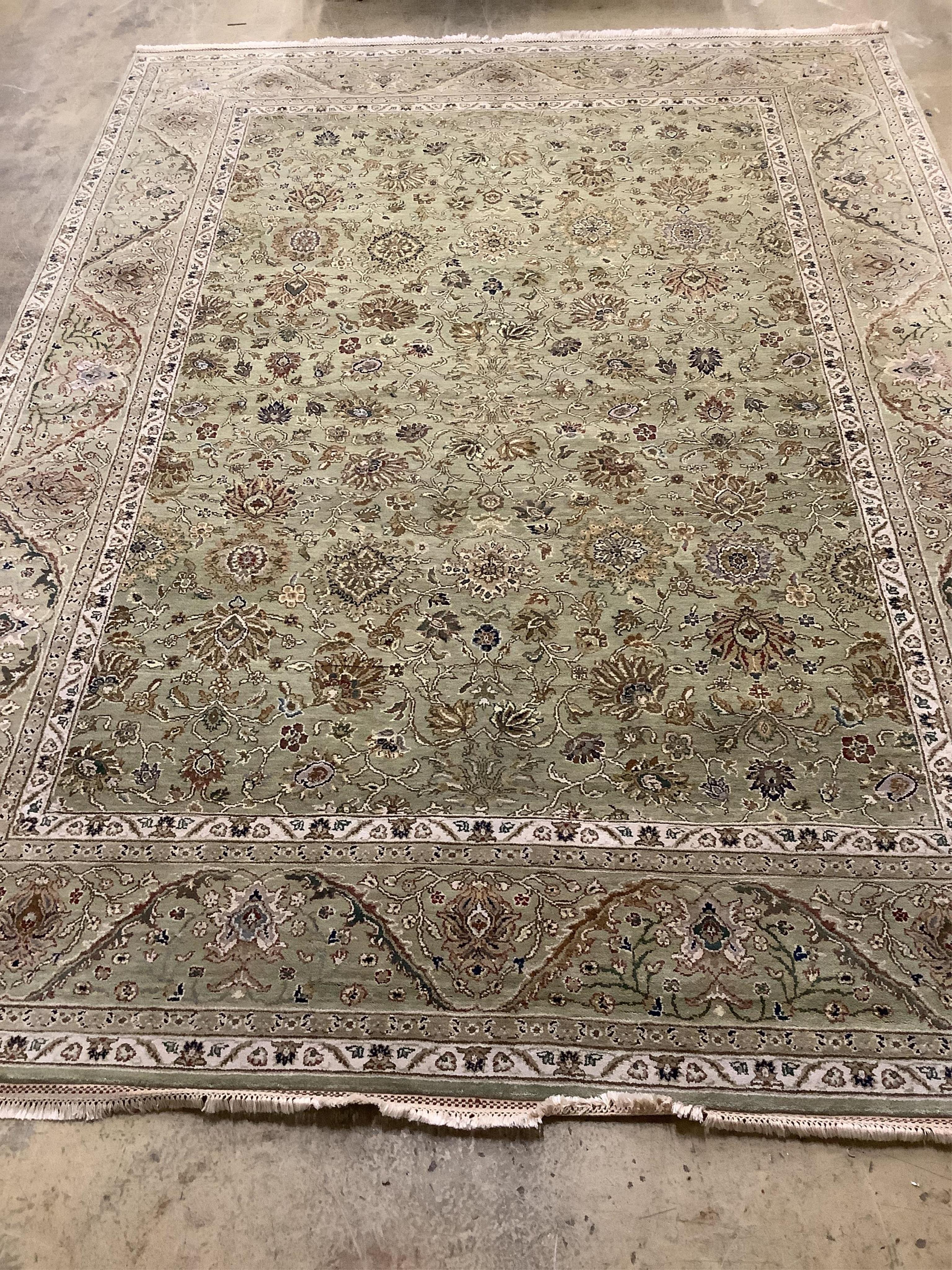 A North West Persian pale green ground carpet, approx. 380 x 280cm. Condition - good